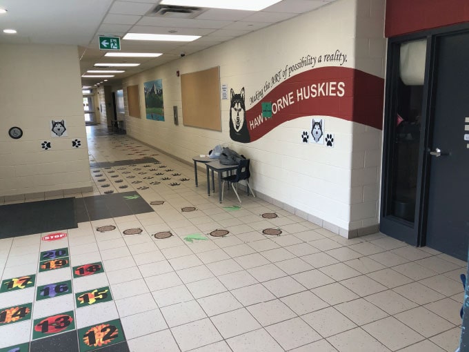 Colorful sensory paths in school hallway for children's play and development.