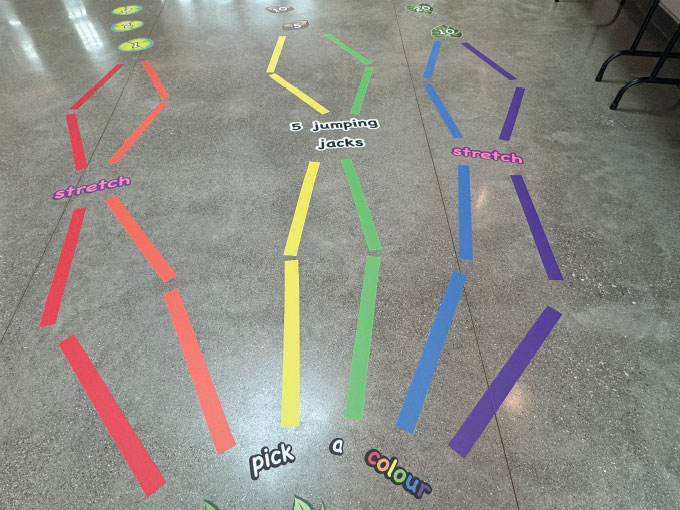 Colorful sensory paths with stretch, jump, and pick activities for children.